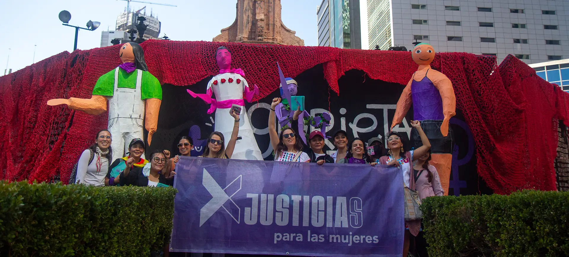 A group of people gathered in a public space during a community event | Co-Impact website.