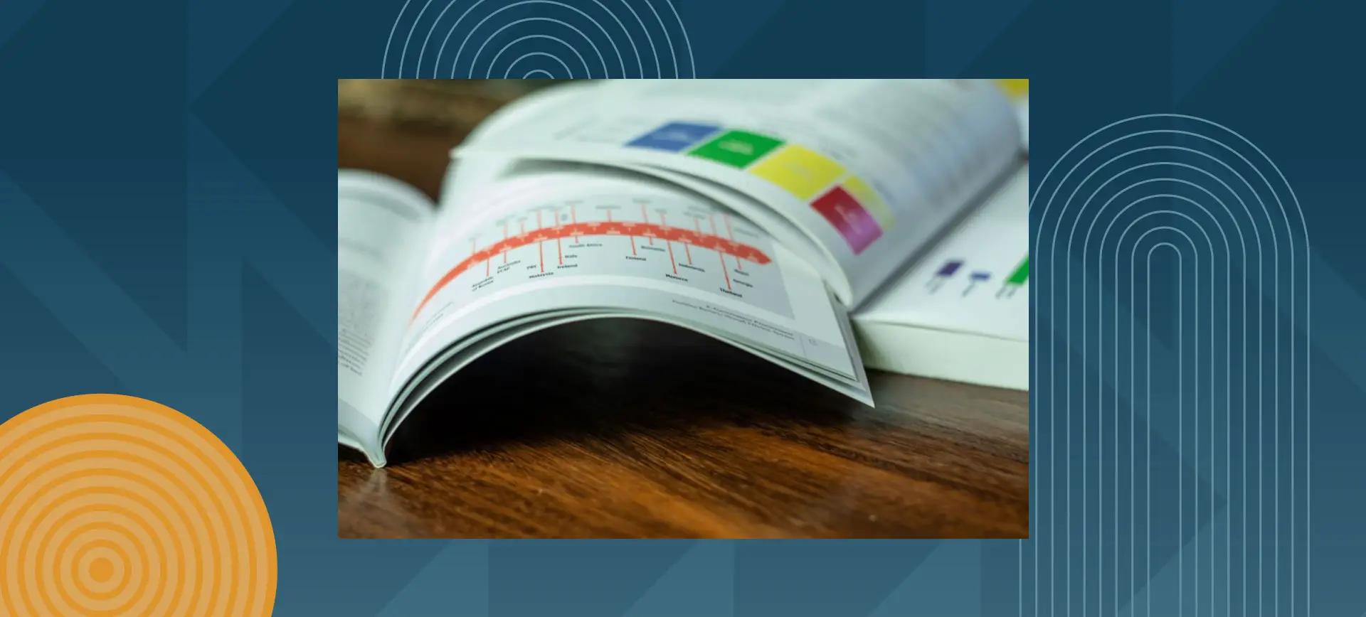 Open book with colorful charts and graphs showing data visualization and statistics on wooden table