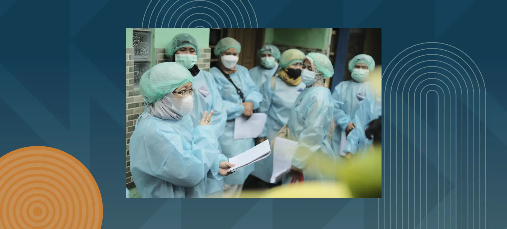 Medical professionals in surgical scrubs and masks during hospital training or briefing session