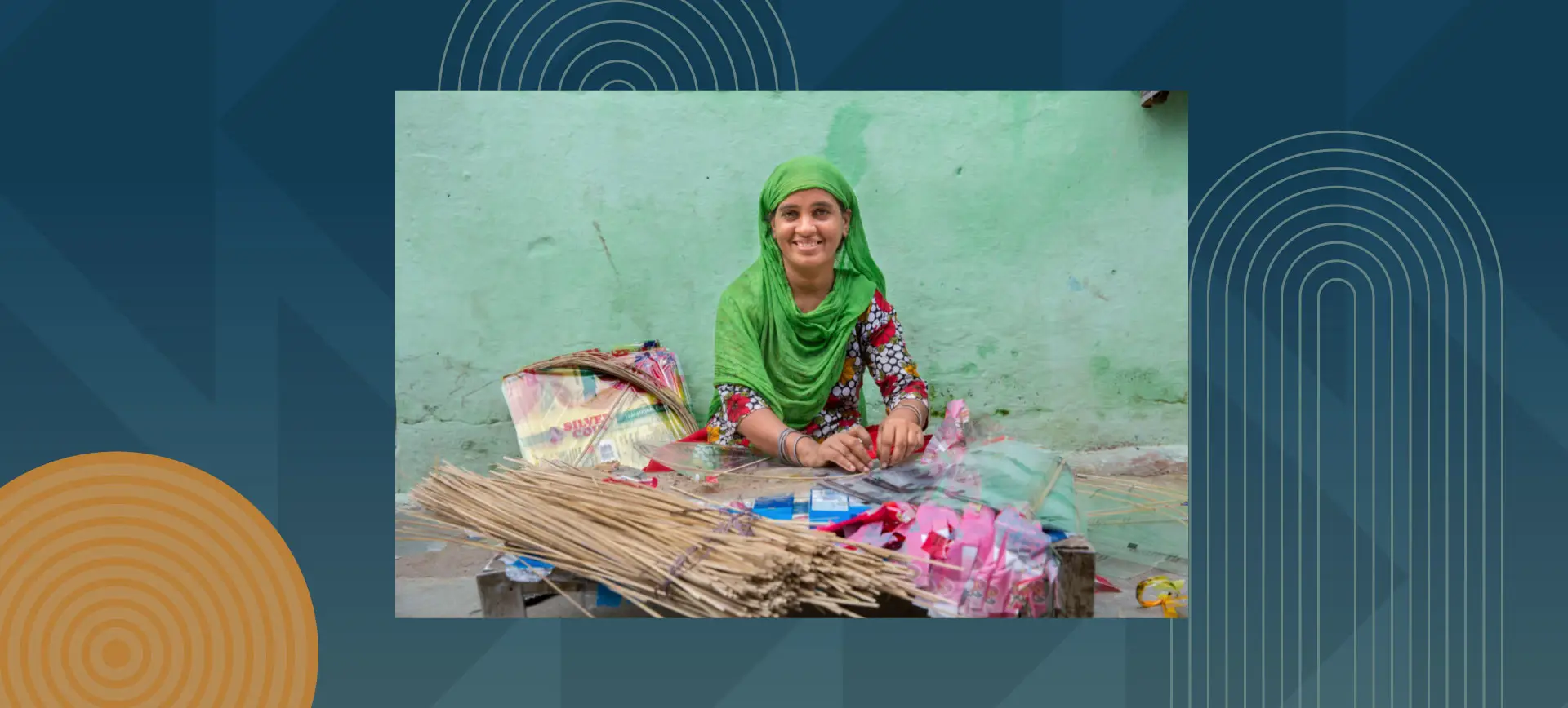 Smiling woman in green headscarf sitting cross-legged selling incense sticks and colorful items on street