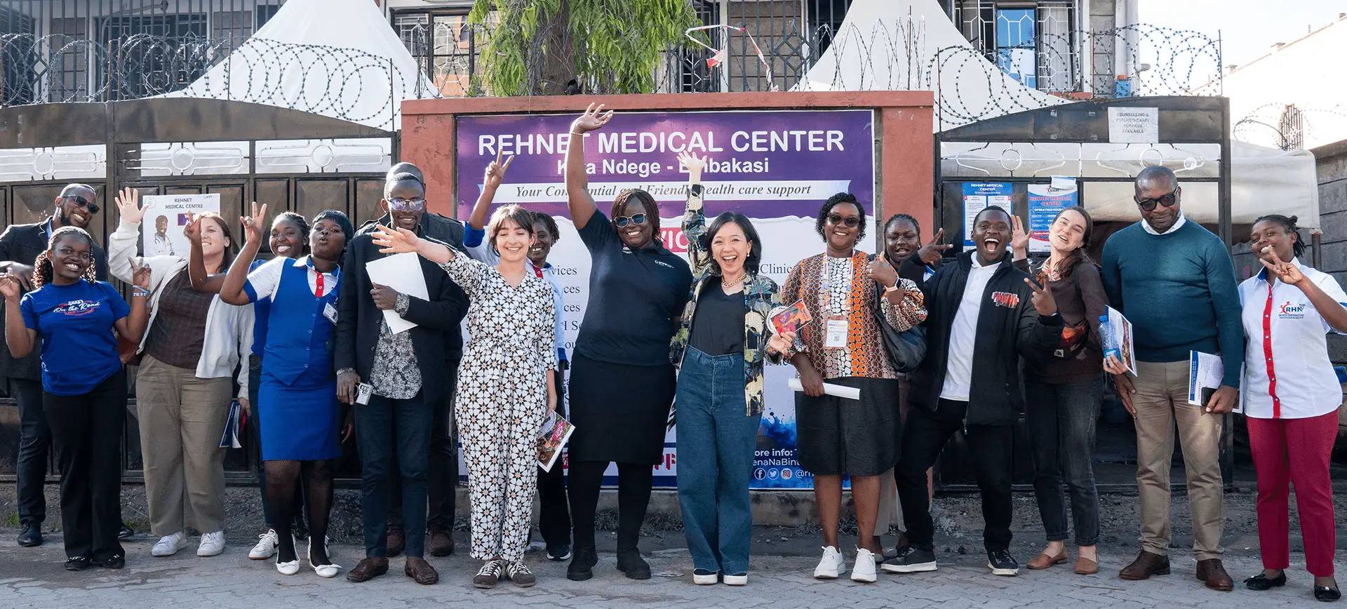 The Co-Impact team, Board member Liz Yee, and RHNK's team members gathered at a site visit in Kenya, April 2026. Photo by AfricaXchange