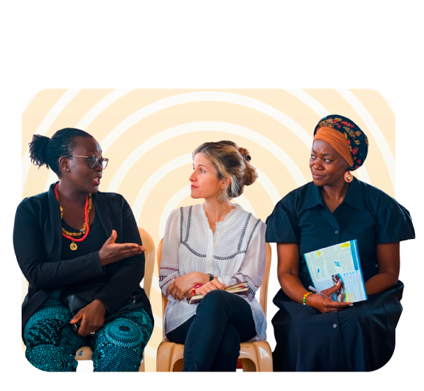 Three women in conversation representing collaboration and shared dialogue – Co-Impact website