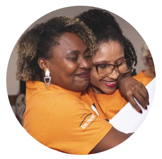 Graphic composition of two people hugging | Co-Impact.