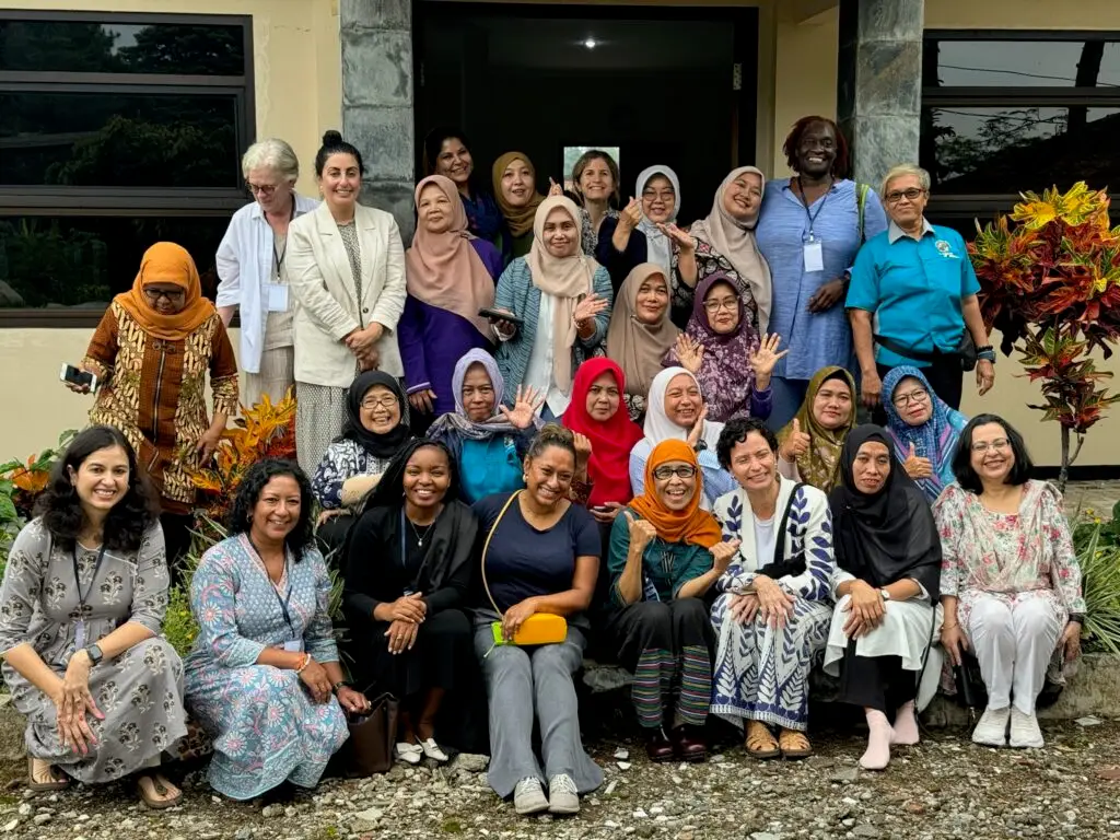 Group of women gathered together representing collaboration and community engagement – Co-Impact website