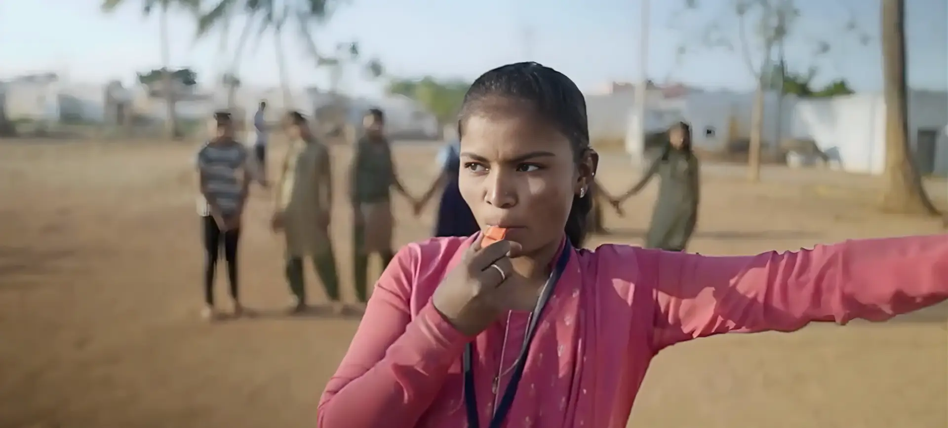 Young woman leading an outdoor group activity | Co-Impact website